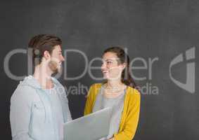 Happy business people talking against grey background