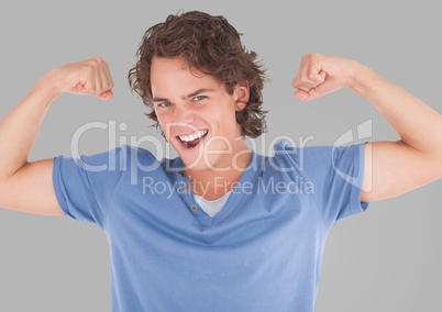 Portrait of Man flexing arm muscles with grey background