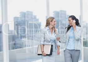 Happy business women holding devices