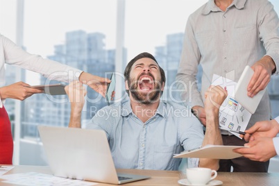 Frustrated business man at a desk yelling