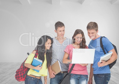 Group of students standing in front of blank room background