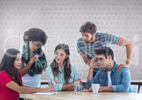 Group of friends sitting in front of blank grey background