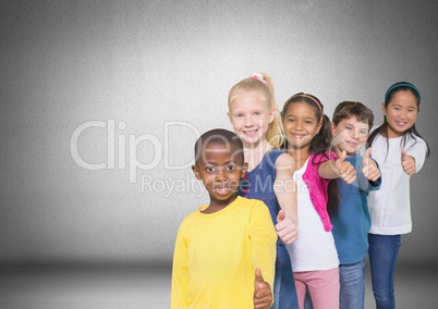 Group of children standing in front of blank grey background