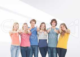 Group of friends standing in front of blank grey background