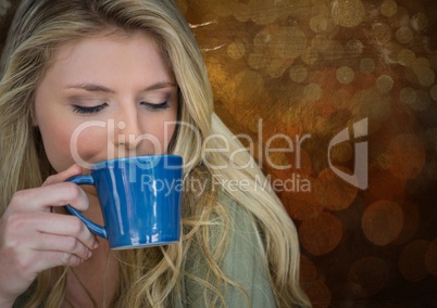 Portraiture of woman drinking coffee against brown bokeh