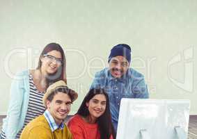 Group of people on laptop in front of bright background