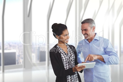 Happy business people using a computer