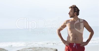 Man at the beach standing in the sand