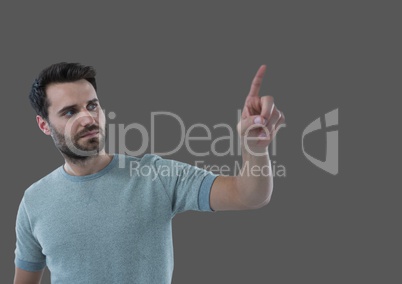 Portrait of Man pointing with grey background