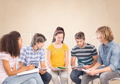 Group of students sitting in front of blank bright background