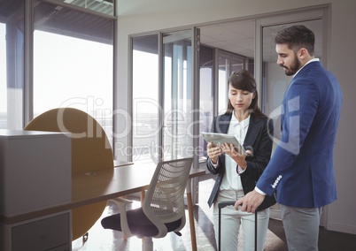 Business people looking at a tablet