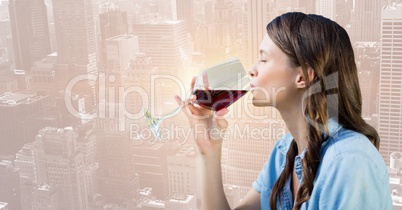 Woman tasting wine against blurry skyline