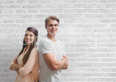 Happy business people standing against white wall