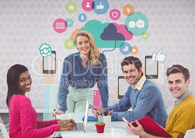 Group of people at desk in front of app graphics