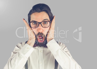 Portrait of shocked surprised Man with grey background