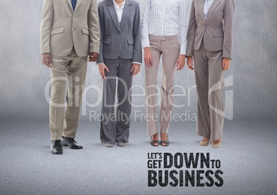 Group of business people standing in front of blank grey background with Down to Business text