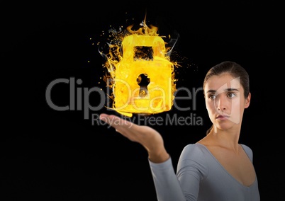 Woman holding out hand with fiery padlock over black background