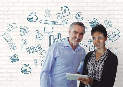 Happy business people using a tablet against white wall with graphics