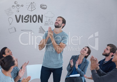 Group meeting sitting in circle in front of Vision text graphics