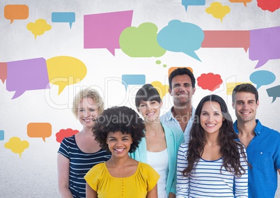 Group of people standing in front of colorful chat bubbles