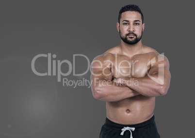 Portrait of strong muscular Man with grey background