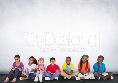 Group of children sitting in front of blank grey background