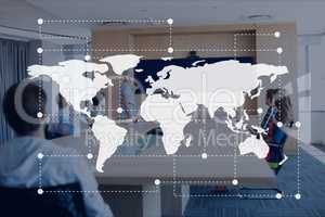 World map icon against office meeting background