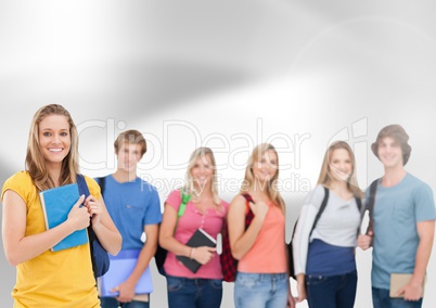 Group of students standing in front of grey background
