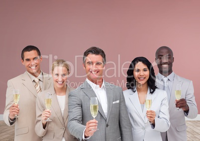 Group of business people holding champagne in front of rose background
