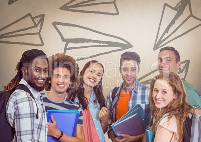Group of students standing in front of paper airplane graphics
