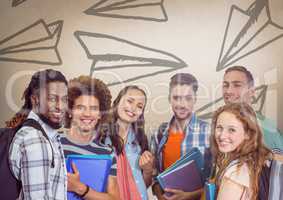 Group of students standing in front of paper airplane graphics