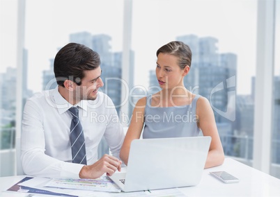 Business people at a desk using a computer