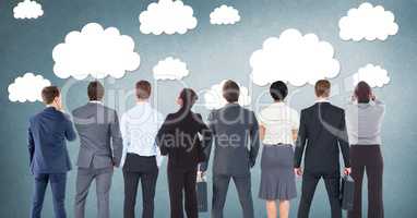 Group of business people standing in front of clouds graphics