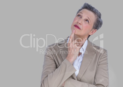 Portrait of old woman in suit with grey background