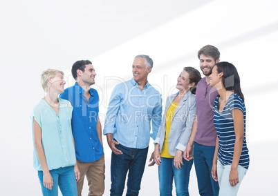 Group of people standing in front of blank bright background