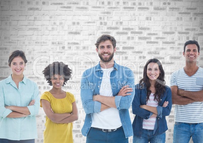 Group of people standing in front of brick grey background