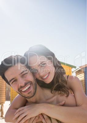 Happy couple at the beach embracing