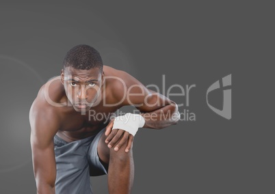 Portrait of fit muscular Man with grey background