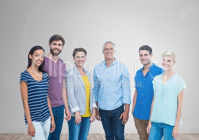 Group of people standing in front of blank grey background