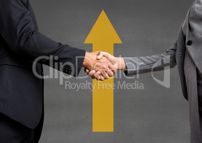 Business people shaking hands against grey background with a yellow arrow