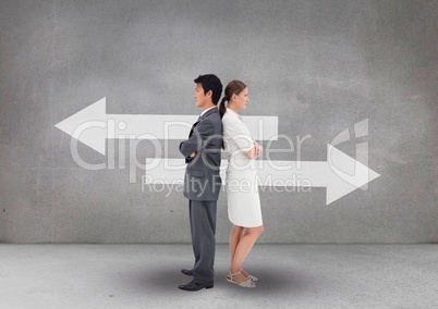 Business people standing against grey background with white arrows