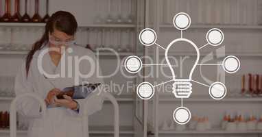 Bulb icon against woman at the laboratory photo