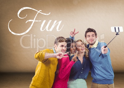 Group of friends taking selfie in front of blank brown background  with Fun text