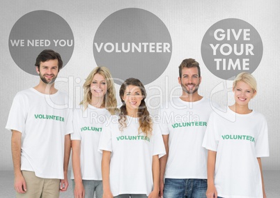 Group of volunteers standing in front of Volunteer graphics