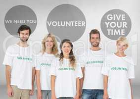 Group of volunteers standing in front of Volunteer graphics