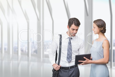 Business people looking at a tablet