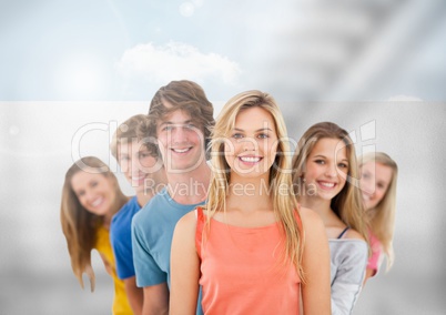 Group of young people standing in front of blurred background