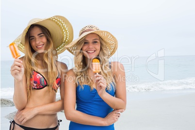 Happy women at the beach eating  ice cream