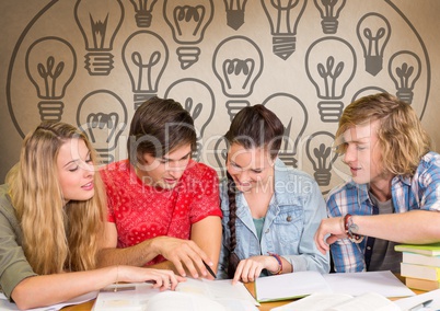 Group of students studying in front of light bulbs graphics