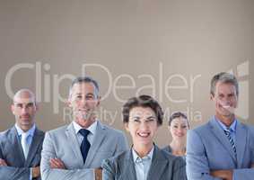 Group of business people standing in front of brown background